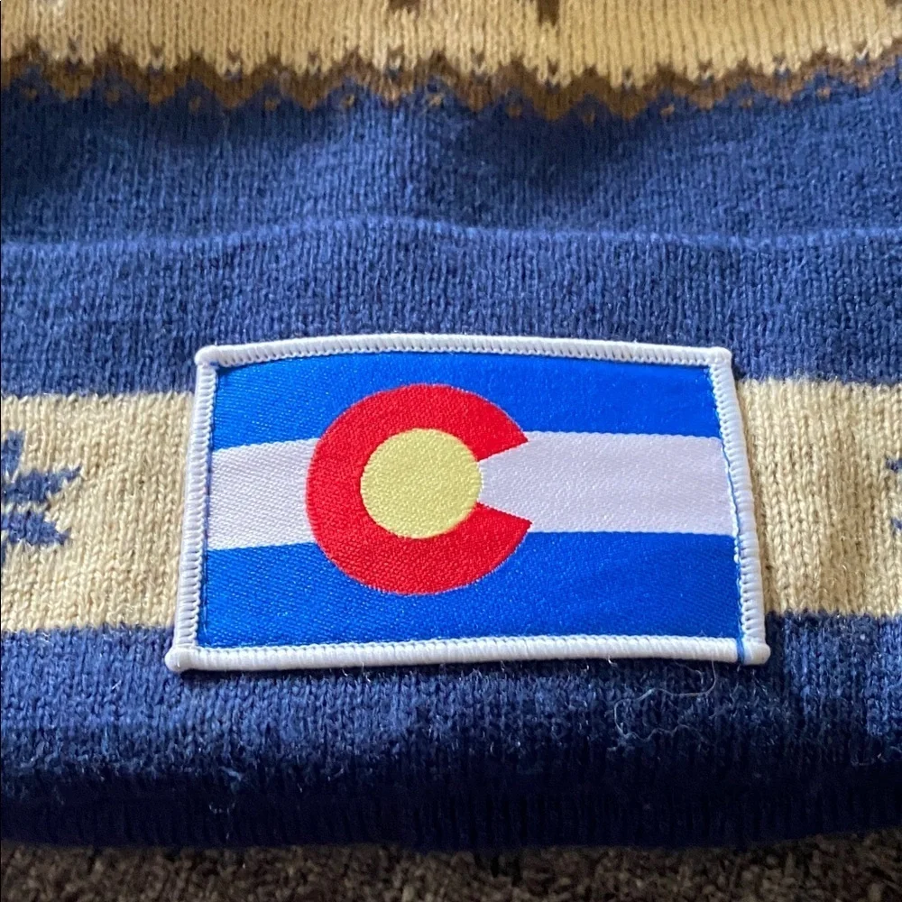 Cirque Blue and Tan Beanie with Colorado Patch. Designed in Vail, CO.